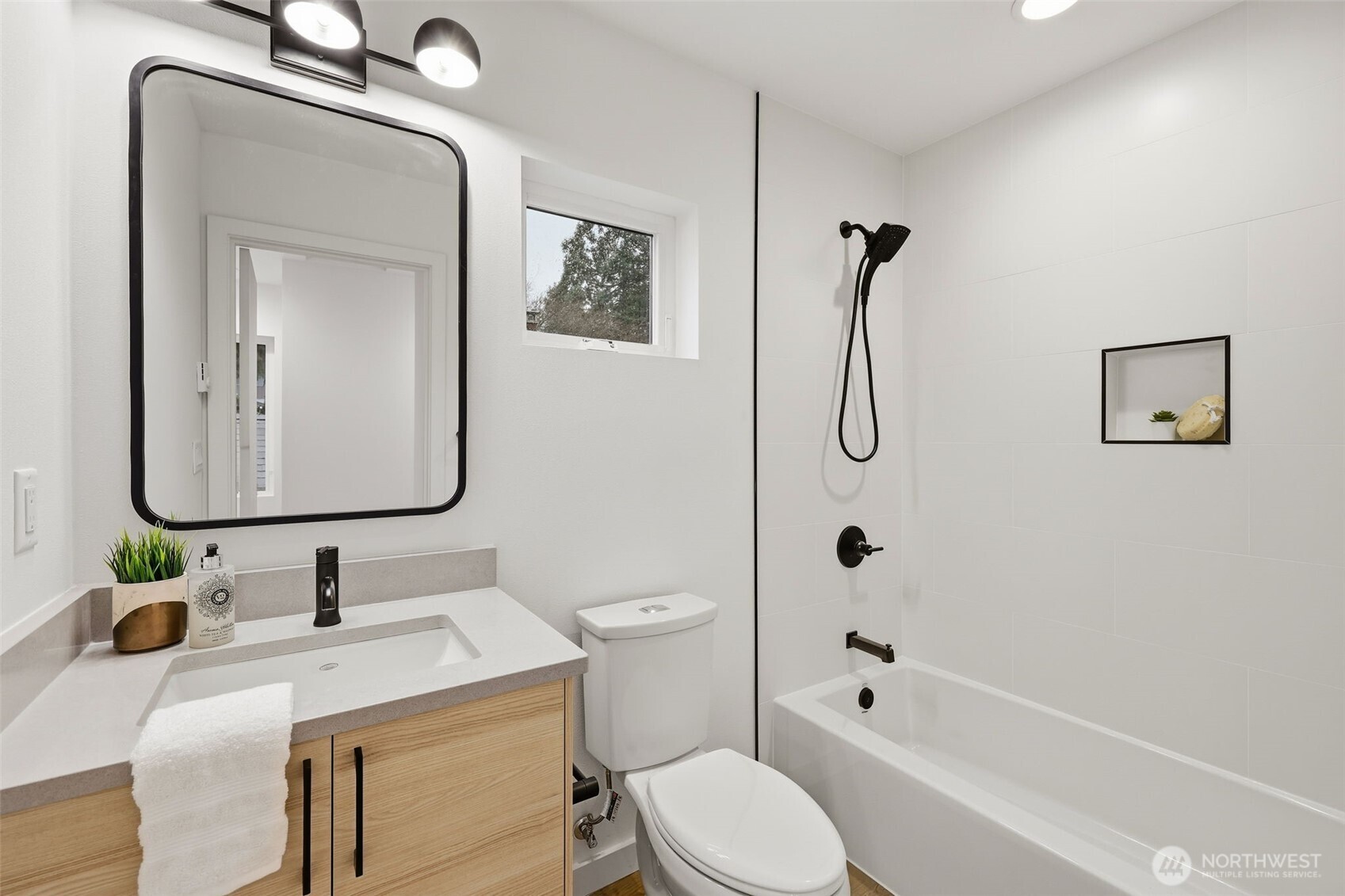 14304 1st Avenue Northwest Seattle, WA 98133 - Photo 14 of 18 a bathroom with a granite countertop sink toilet and shower