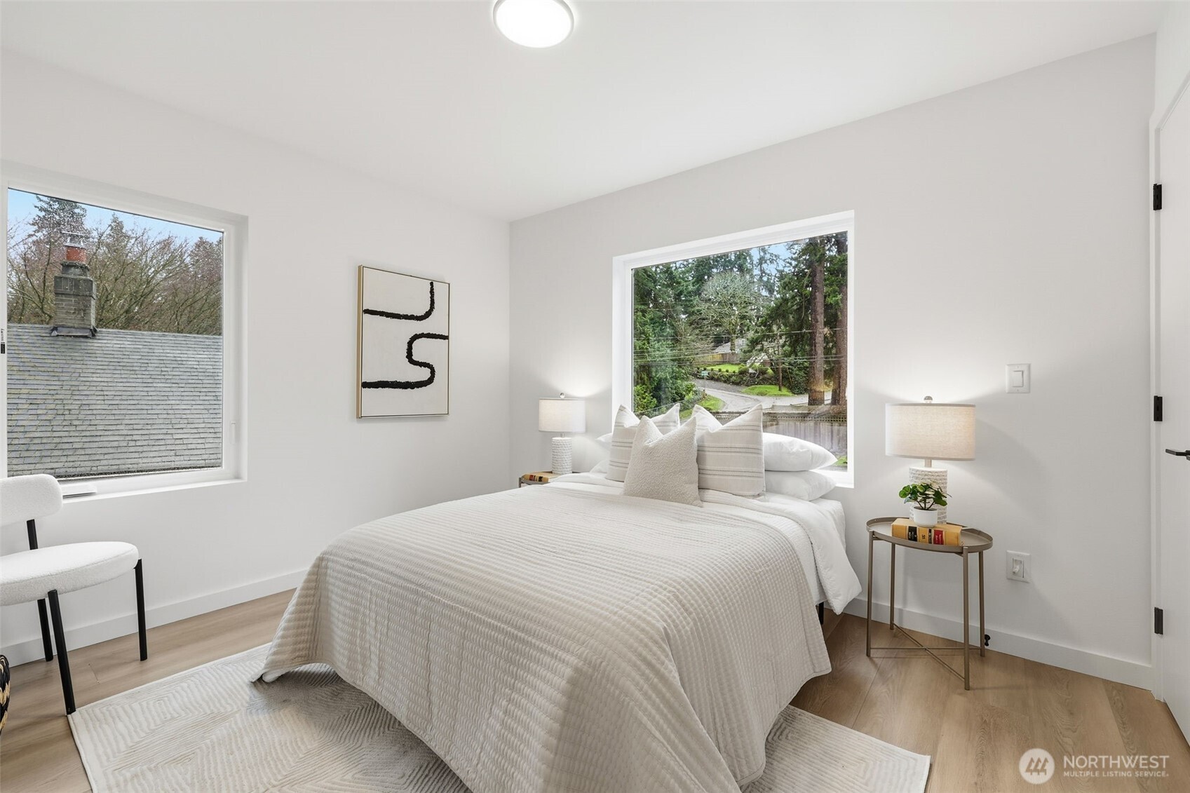 14304 1st Avenue Northwest Seattle, WA 98133 - Photo 15 of 18 a bedroom with a bed and a window