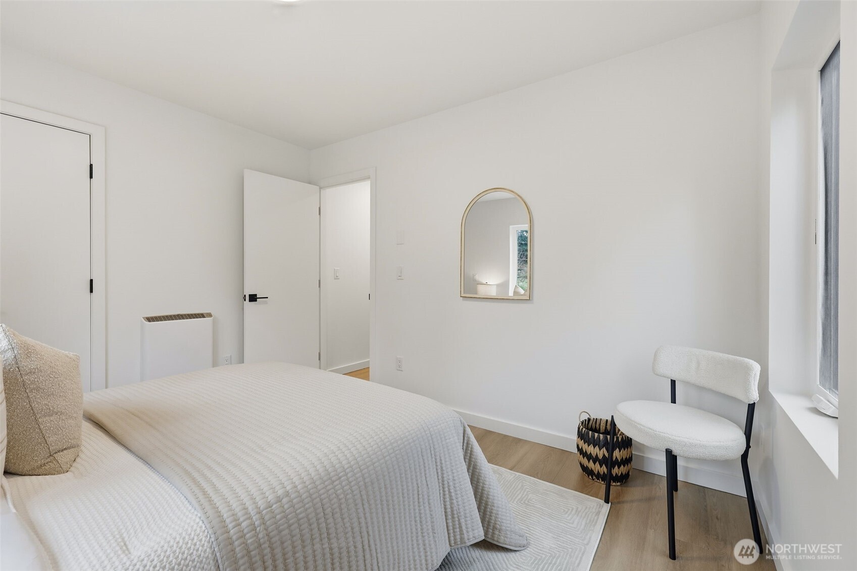 14304 1st Avenue Northwest Seattle, WA 98133 - Photo 16 of 18 a bedroom with a bed and a chair