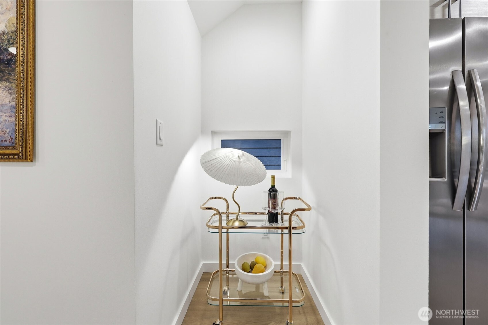 14304 1st Avenue Northwest Seattle, WA 98133 - Photo 9 of 18 a view of kitchen utility room with wooden floor washer and dryer