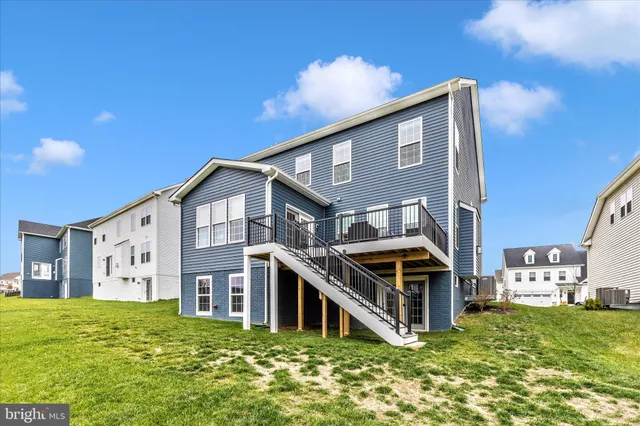 a view of a backyard with sitting area