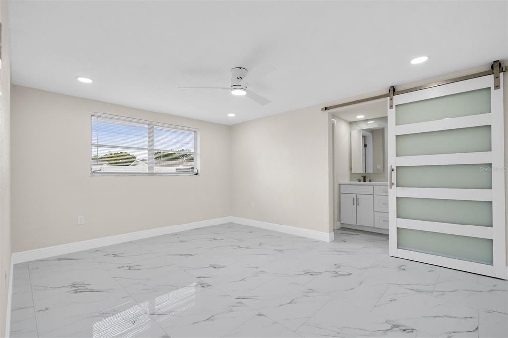 5626 Moog Road Holiday, FL 34690 - Photo 16 of 38 a view of an empty room with a window