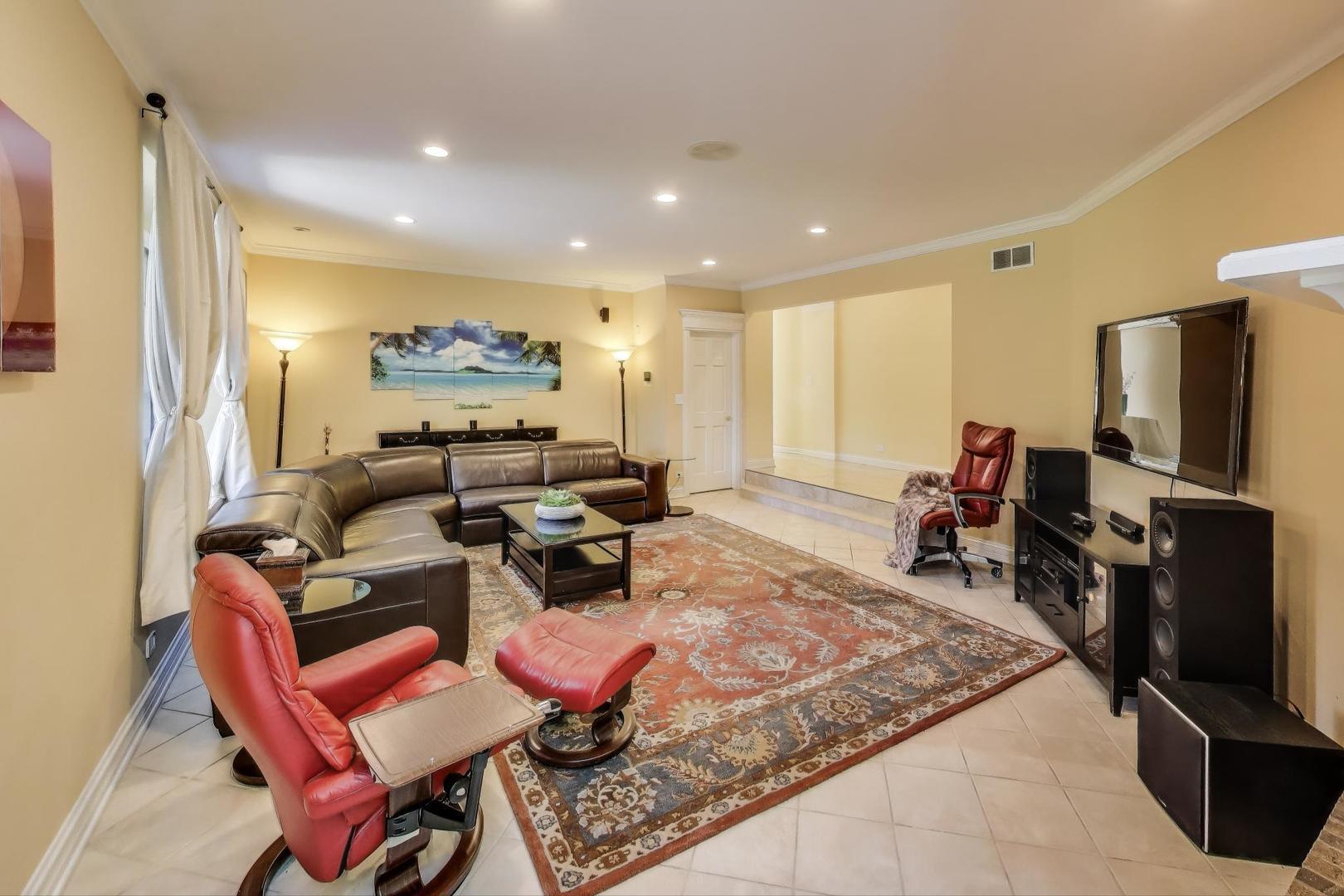 1920 Wedgewood Drive Lake Forest, IL 60045 - Photo 14 of 53 a living room with furniture a flat screen tv and a refrigerator