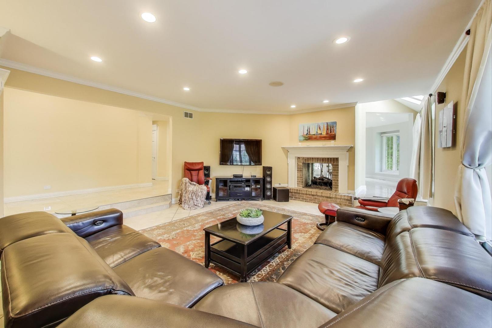 1920 Wedgewood Drive Lake Forest, IL 60045 - Photo 15 of 53 a living room with fireplace furniture and a flat screen tv