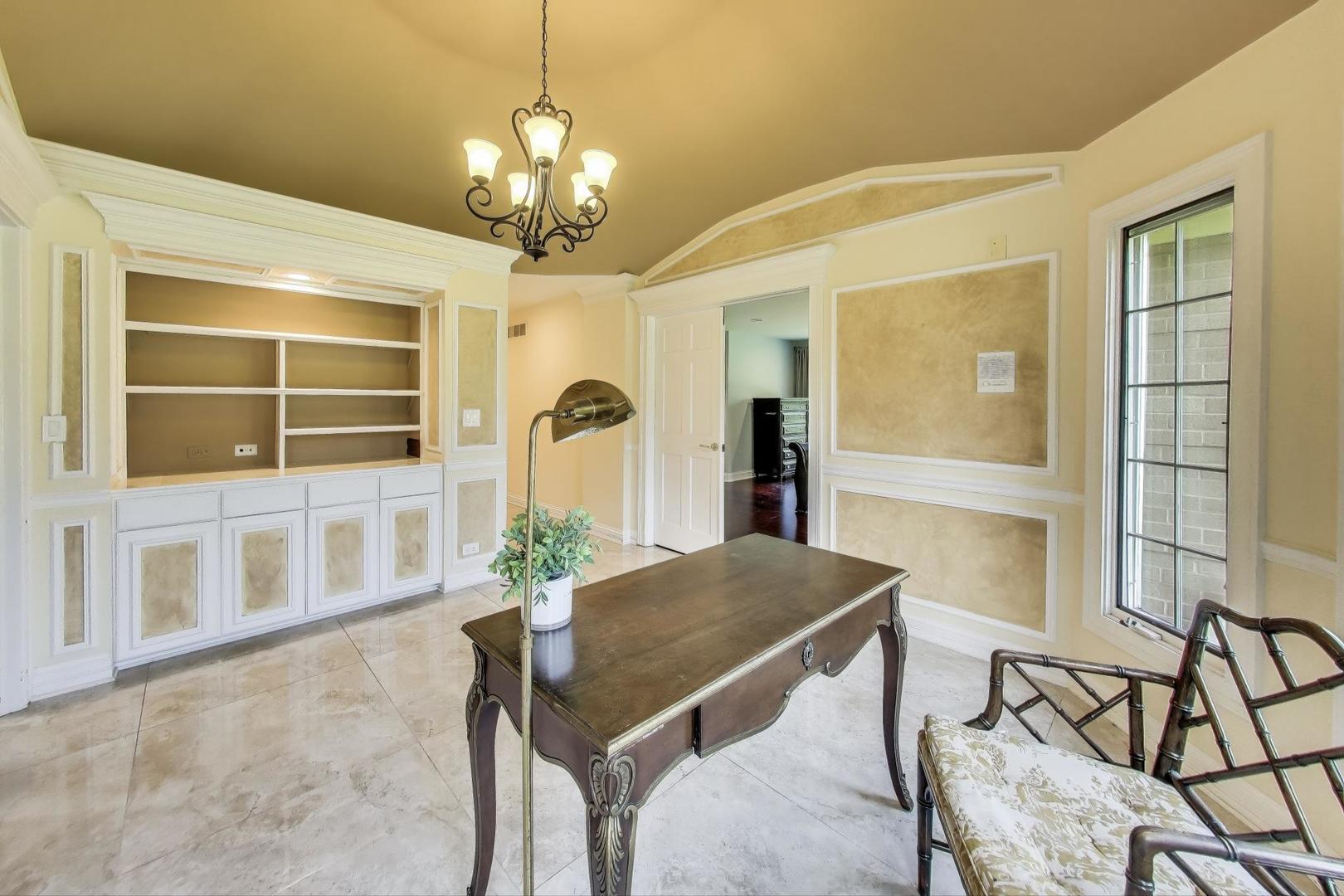 1920 Wedgewood Drive Lake Forest, IL 60045 - Photo 19 of 53 a view of a dining room with furniture and a large window