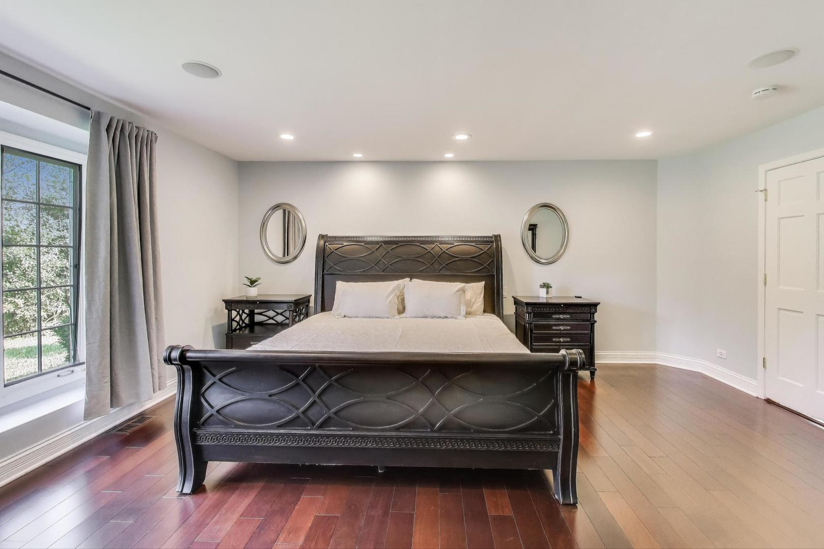 1920 Wedgewood Drive Lake Forest, IL 60045 - Photo 21 of 53 a bedroom with a bed and wooden floor