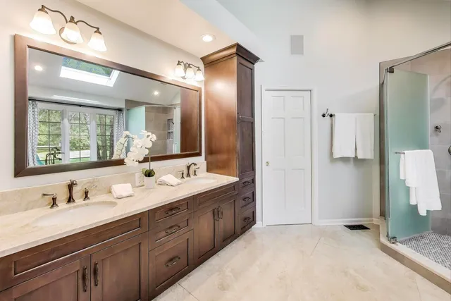 a bathroom with a tub and shower