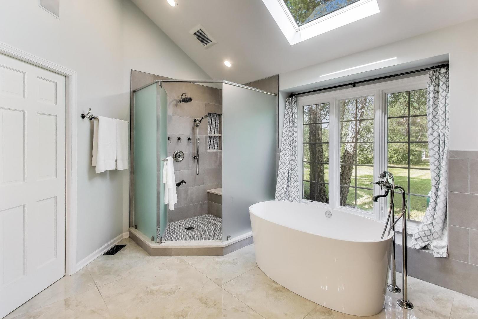 1920 Wedgewood Drive Lake Forest, IL 60045 - Photo 24 of 53 a bathroom with a tub and shower