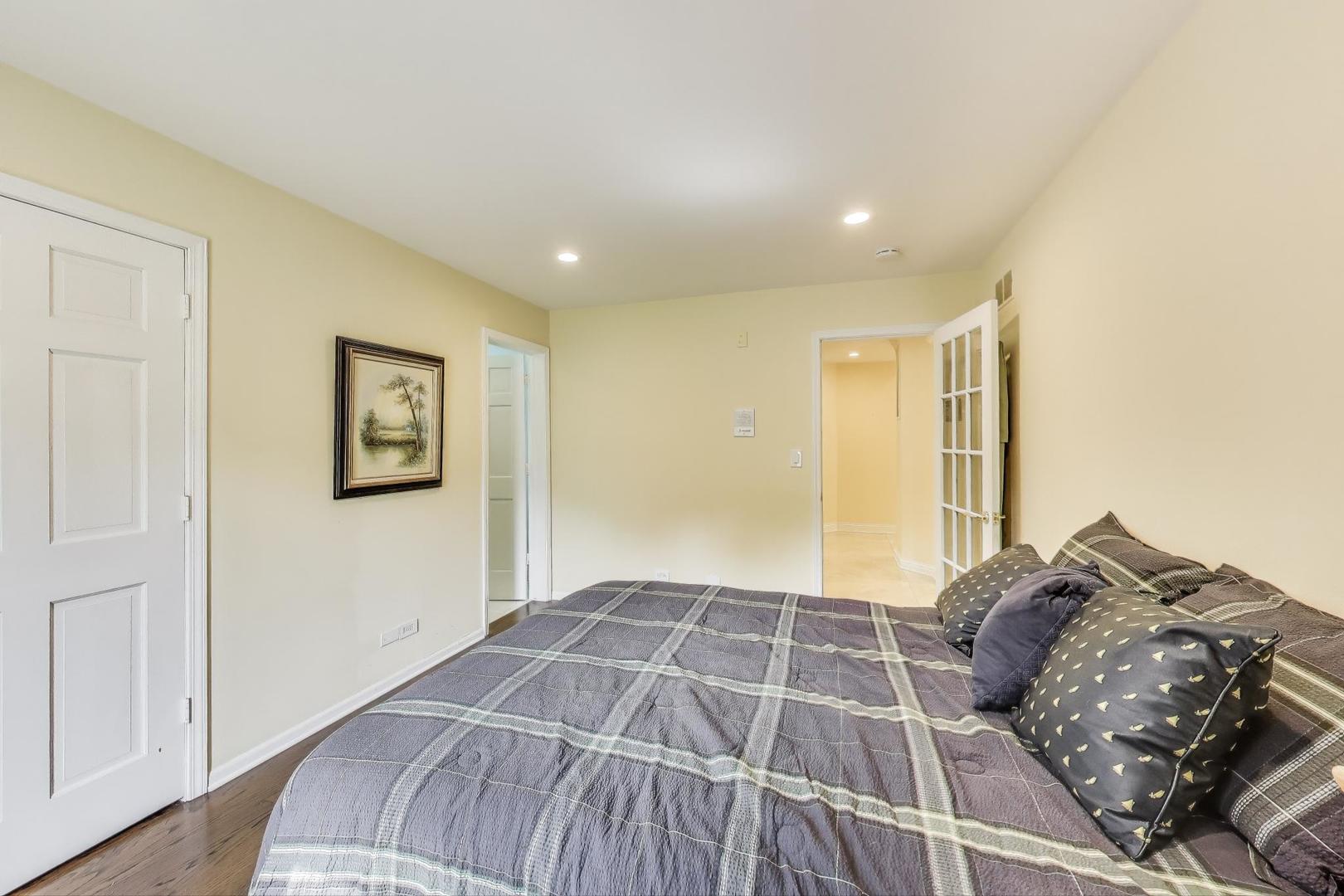 1920 Wedgewood Drive Lake Forest, IL 60045 - Photo 26 of 53 a bedroom with a large bed and a window