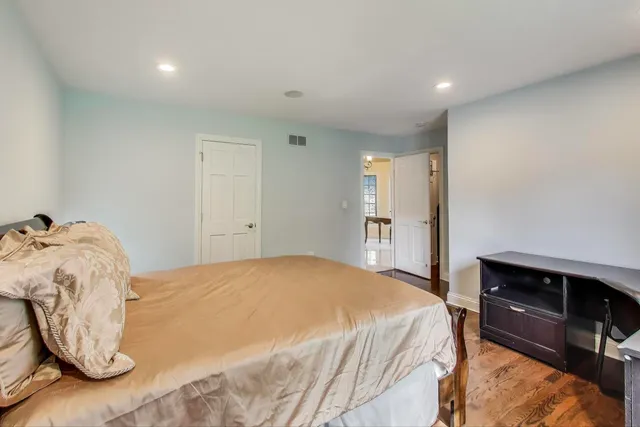 a spacious bathroom with a double vanity sink mirror and toilet