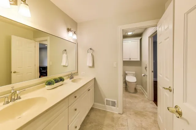 a bathroom with a sink a mirror and a shower