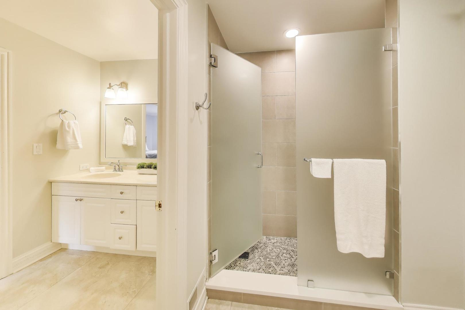 1920 Wedgewood Drive Lake Forest, IL 60045 - Photo 31 of 53 a bathroom with a sink a mirror and a shower