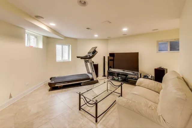 a view of kitchen with refrigerator stove and a sink