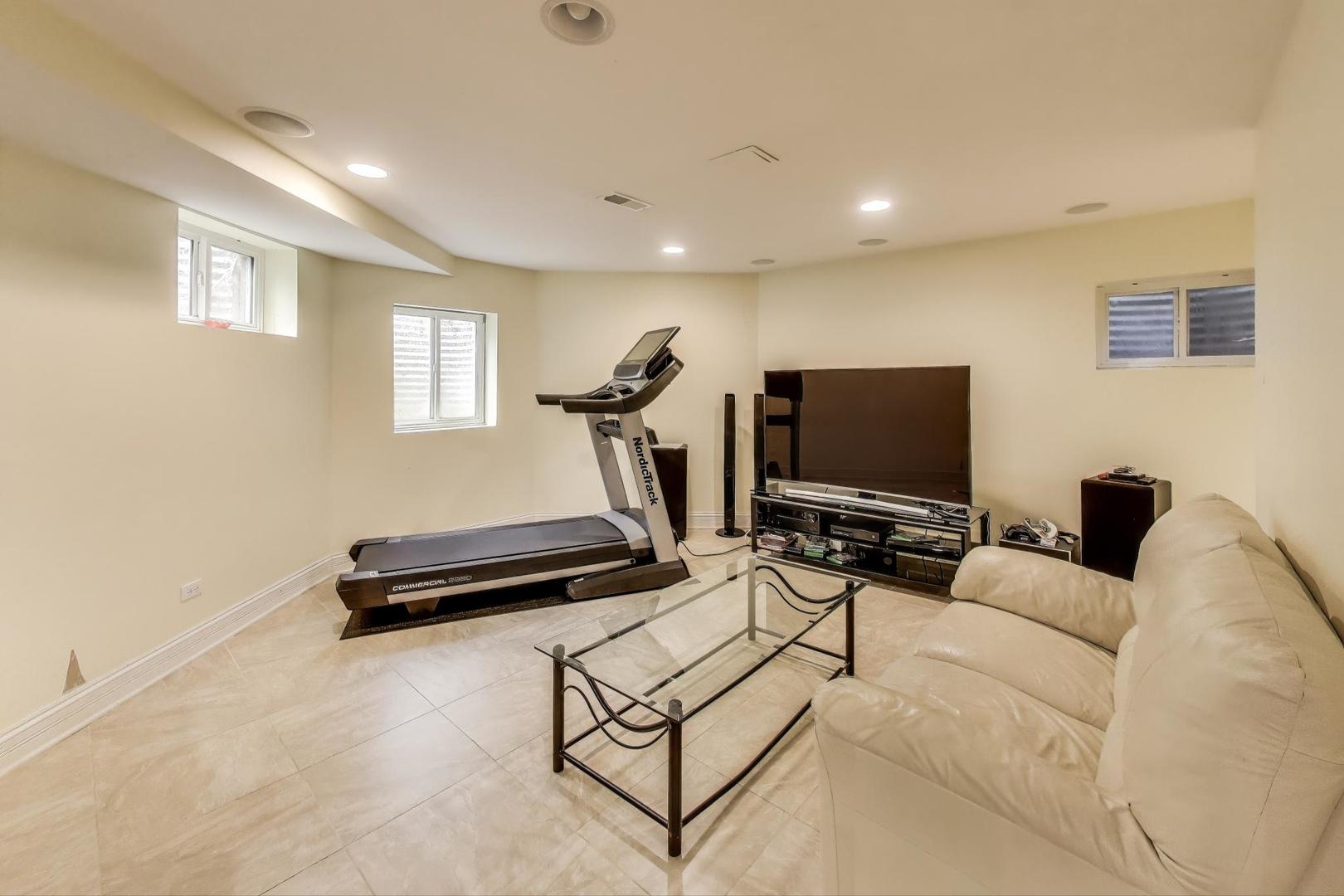 1920 Wedgewood Drive Lake Forest, IL 60045 - Photo 35 of 53 a living room with furniture and a flat screen tv