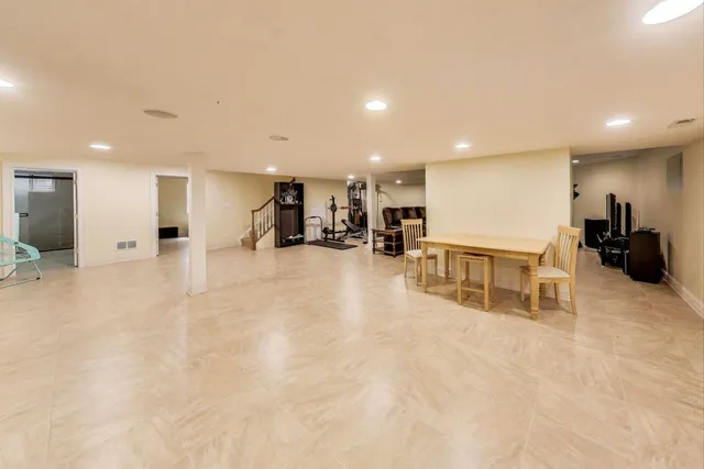 a bedroom with a bed and a television