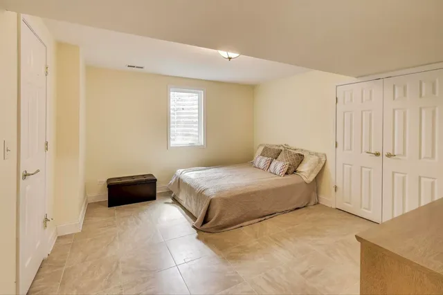 a spacious bathroom with a granite countertop sink toilet and shower
