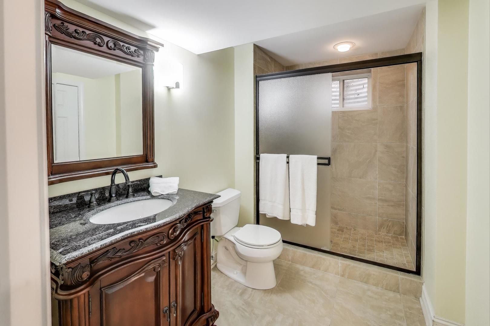 1920 Wedgewood Drive Lake Forest, IL 60045 - Photo 41 of 53 a spacious bathroom with a granite countertop sink toilet and shower