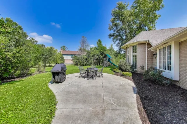 a front view of a house with a big yard