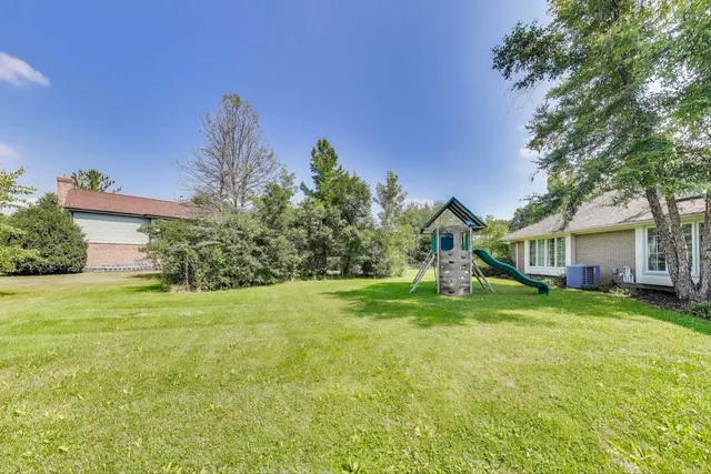 a view of a swimming pool and couch in the patio