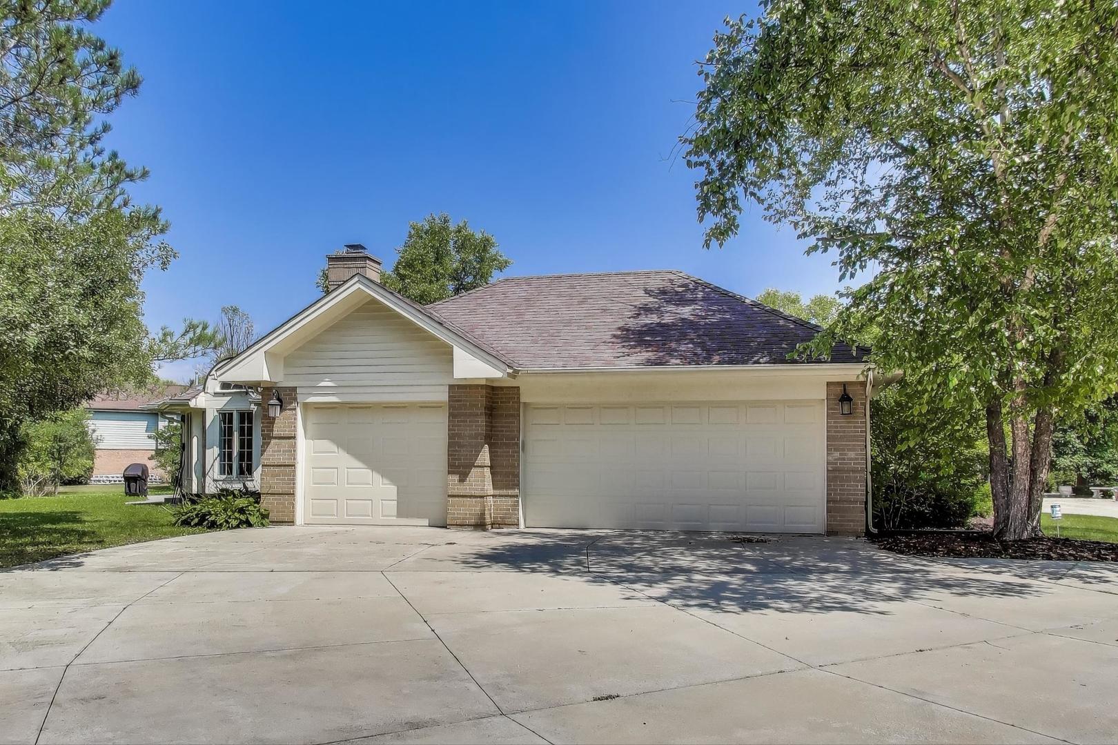 1920 Wedgewood Drive Lake Forest, IL 60045 - Photo 52 of 53 a front view of a house with a yard and garage
