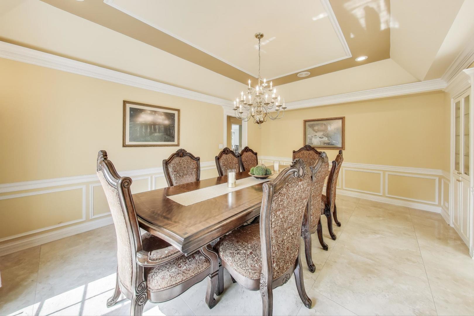 1920 Wedgewood Drive Lake Forest, IL 60045 - Photo 7 of 53 a view of a dining room with furniture and chandelier
