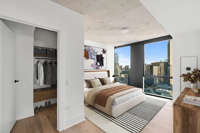 a bedroom with a bed and a view of bathroom