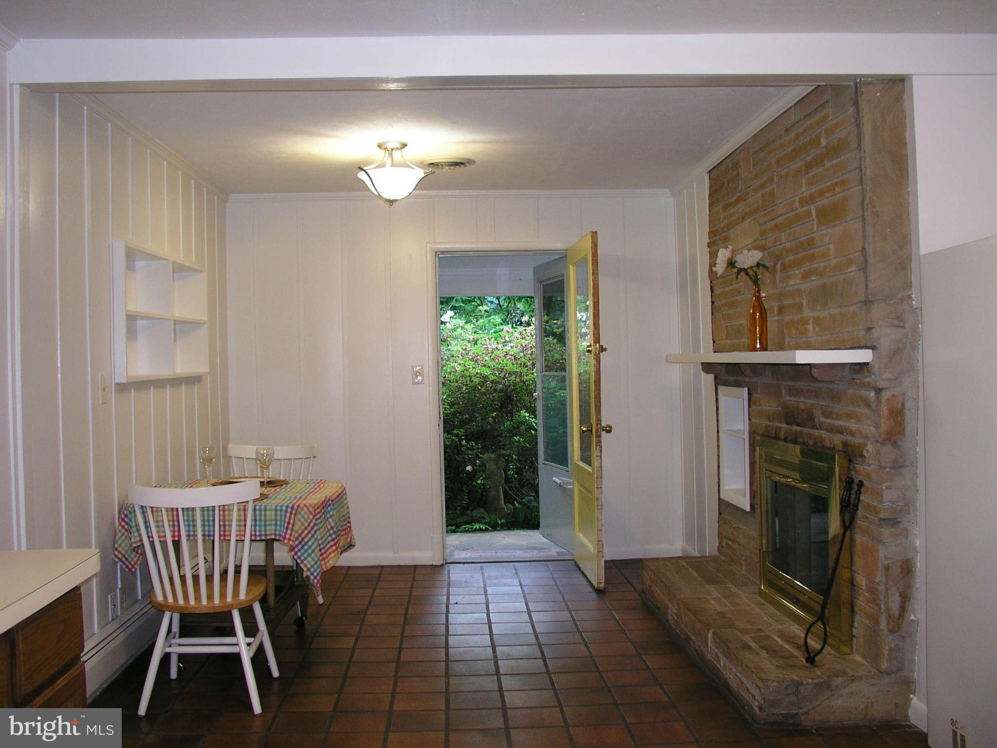 10409 Gary Road, Unit FRONT Potomac, MD 20854 - Photo 10 of 14 a view of a livingroom with furniture and a fireplace