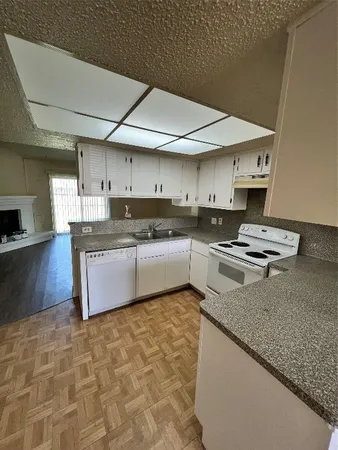 a kitchen with stainless steel appliances granite countertop a granite counter tops and a stove