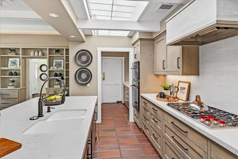 a utility room with sink dryer and washer