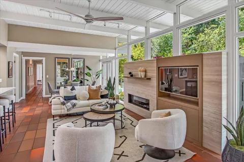 a view of a balcony with wooden floor