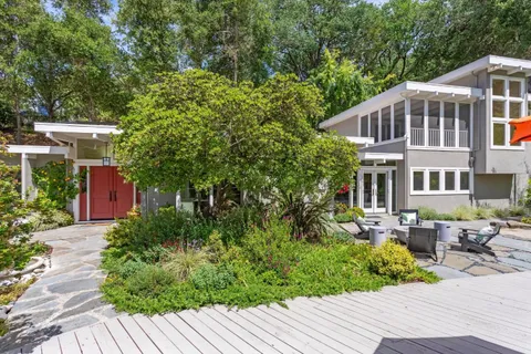 a kitchen with stainless steel appliances granite countertop a stove and cabinets