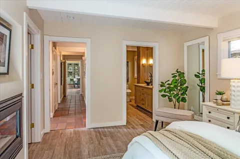 a dining room with furniture a flat screen tv and a large window