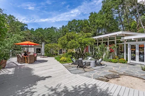 a bedroom with a bed and a fireplace