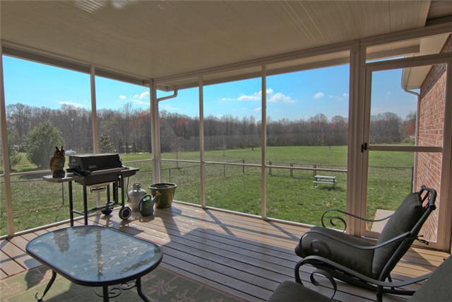 1061 Ferrells Loop Road Manchester, TN 37355 - Photo 3 of 15 Enjoy the view of your back yard from this covered/screened in deck