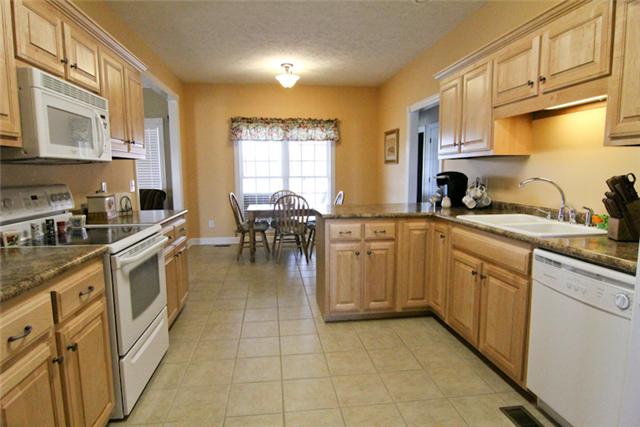 1061 Ferrells Loop Road Manchester, TN 37355 - Photo 7 of 15 Bright kitchen ready for cooking with lots of cabinet space and lovely countertops