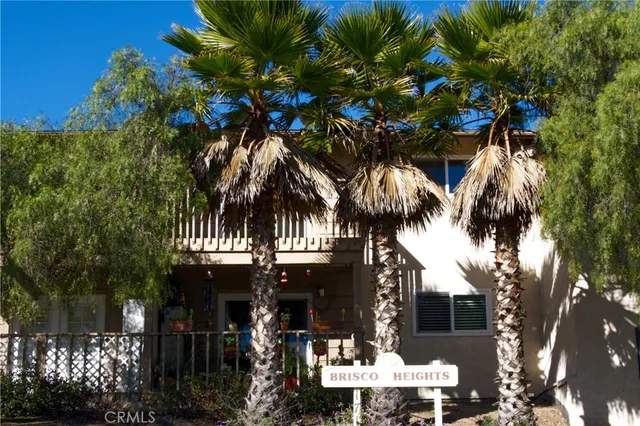 a view of a bedroom with a tree