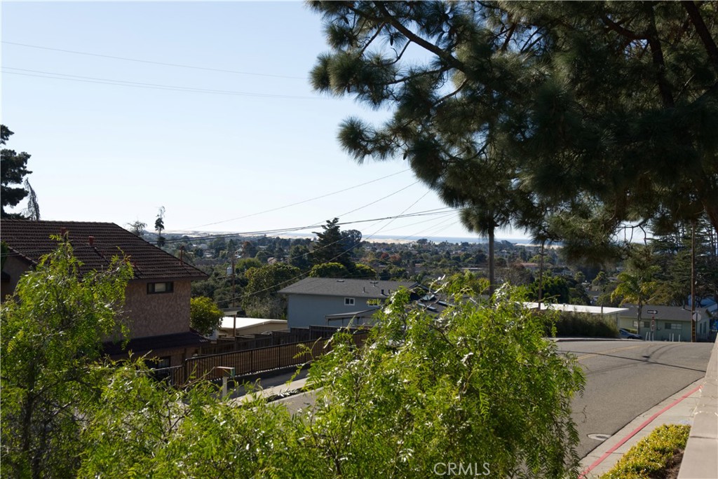 171 Brisco Road, Unit 6 Arroyo Grande, CA 93420 - Photo 12 of 12 a view of a lake with a building in the background