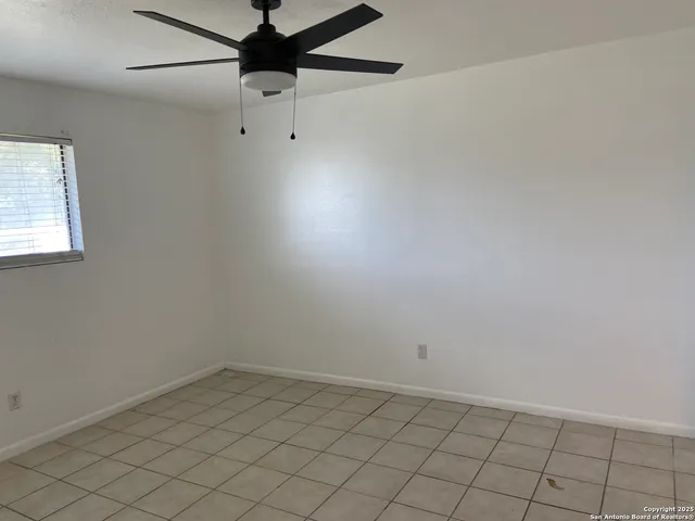 en empty room with fan