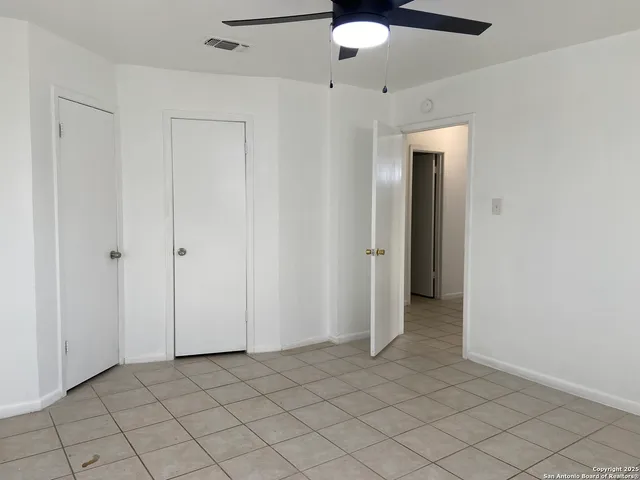 an empty room with fan