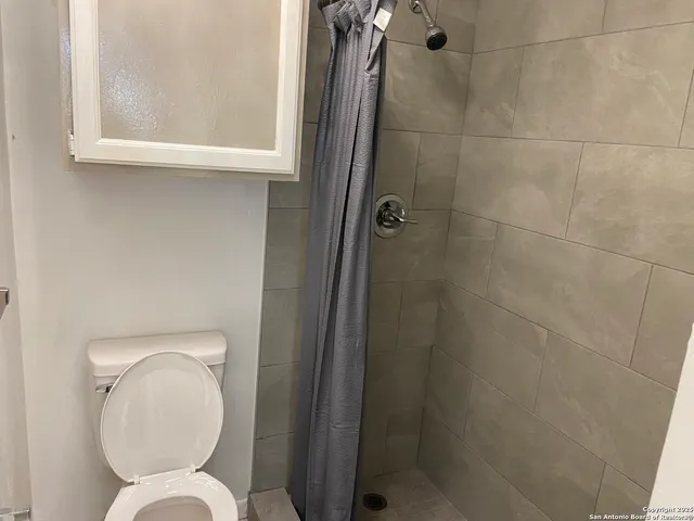 a bathroom with a toilet and a sink