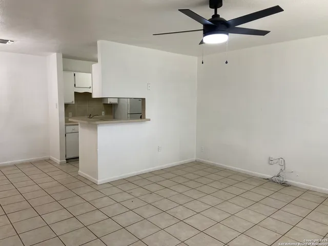 a kitchen with a sink cabinets and stainless steel appliances