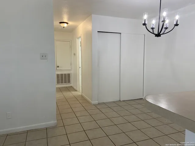 en empty room with wooden floor