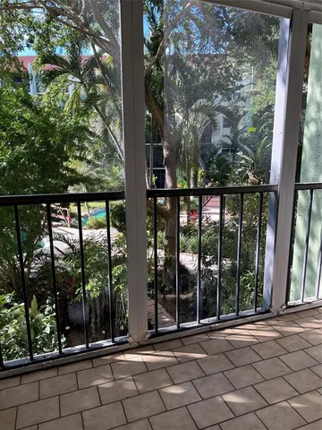 a view of a door and chair in the balcony