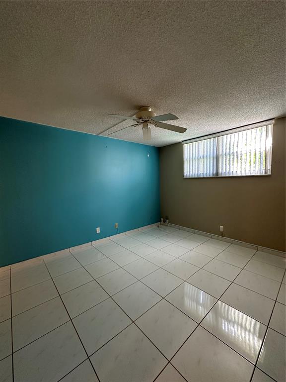 5300 Northeast 24th Terrace, Unit 211C Fort Lauderdale, FL 33308 - Photo 13 of 23 a view of a livingroom with an empty space and a window