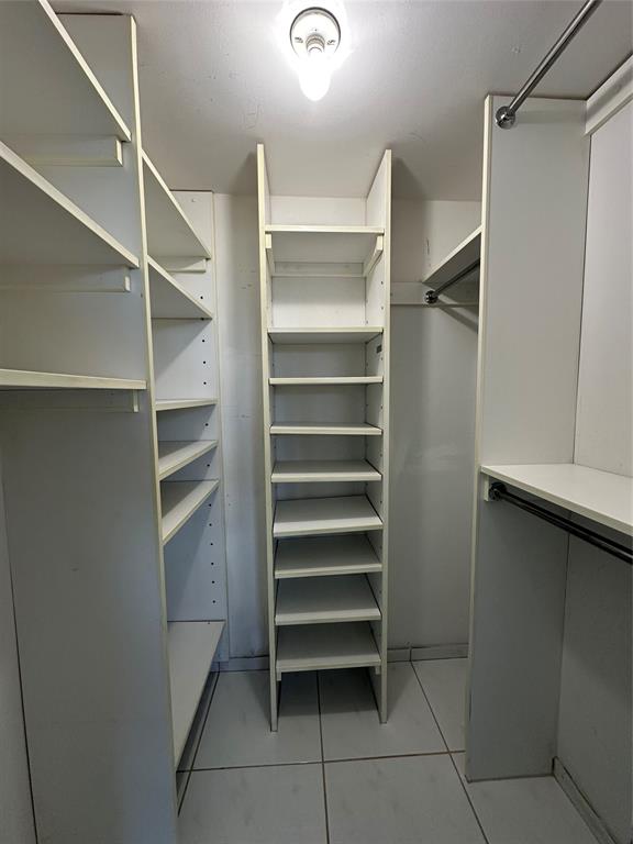 5300 Northeast 24th Terrace, Unit 211C Fort Lauderdale, FL 33308 - Photo 14 of 23 a view of walk in closet with empty racks