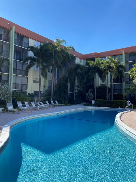 5300 Northeast 24th Terrace, Unit 211C Fort Lauderdale, FL 33308 - Photo 18 of 23 a view of a house with swimming pool yard and patio