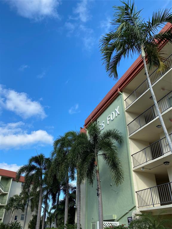 5300 Northeast 24th Terrace, Unit 211C Fort Lauderdale, FL 33308 - Photo 21 of 23 a view of a palm trees front of house