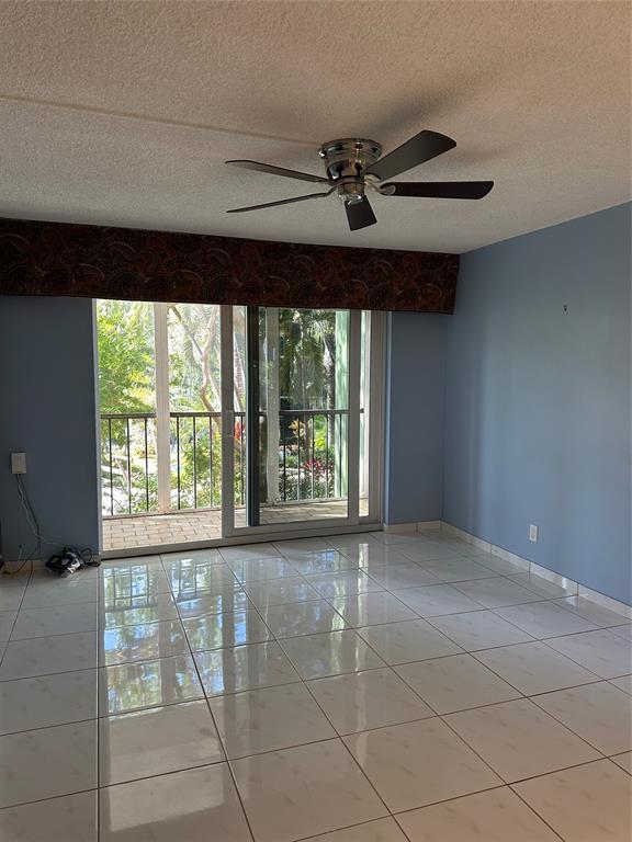 5300 Northeast 24th Terrace, Unit 211C Fort Lauderdale, FL 33308 - Photo 3 of 23 a view of an empty room with a window