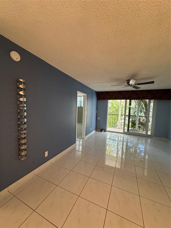 5300 Northeast 24th Terrace, Unit 211C Fort Lauderdale, FL 33308 - Photo 6 of 23 a view of an empty room with a window