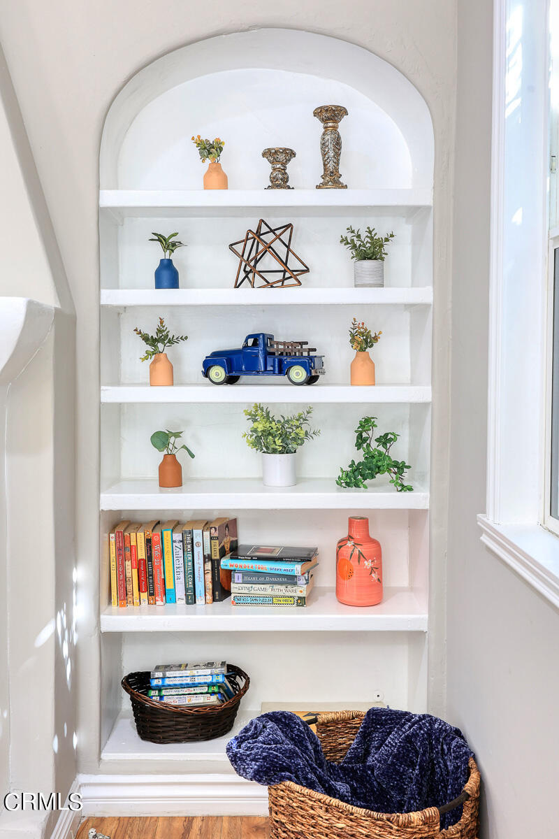 2116 Summit Avenue Altadena, CA 91001 - Photo 12 of 31 a shelf with books and knick knacks on it
